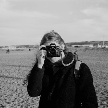 Rain O'Sullivan holding a camera